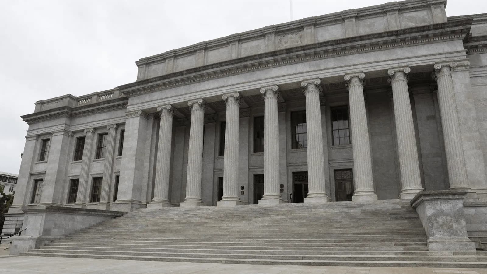 The colonnaded facade of a government regulatory building