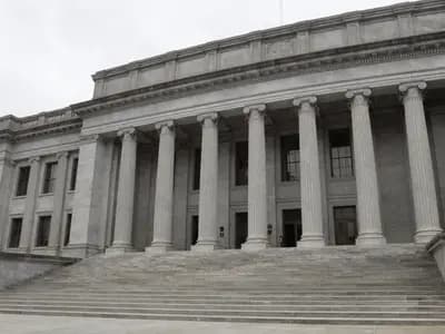 The colonnaded facade of a government regulatory building