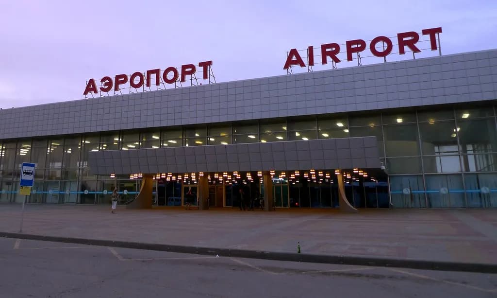 Football supporters traveling through an airport during a major tournament