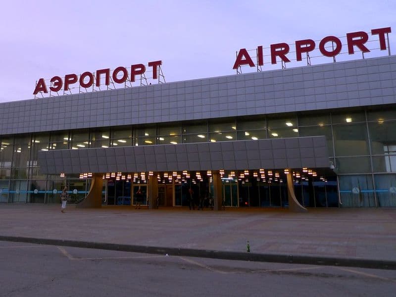 Football supporters traveling through an airport during a major tournament