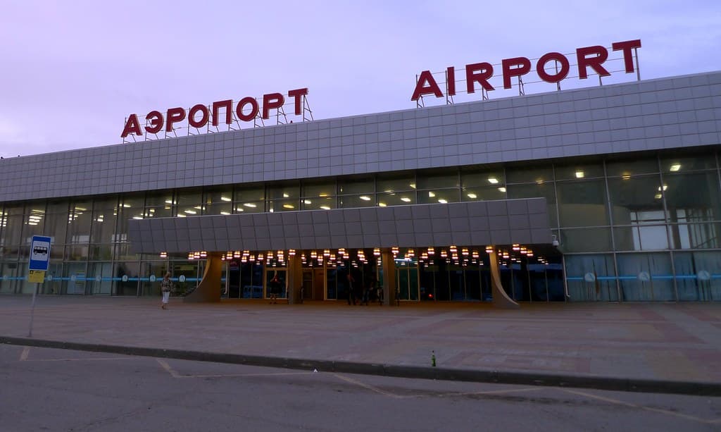 Football supporters traveling through an airport during a major tournament