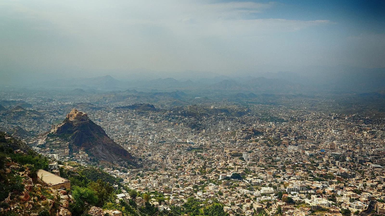 A wide view over the dense buildings of the city of Taiz in Yemen with the Saber mountain behind, photographed on 24 September 2014, a file photograph of the city and not of the recent fighting