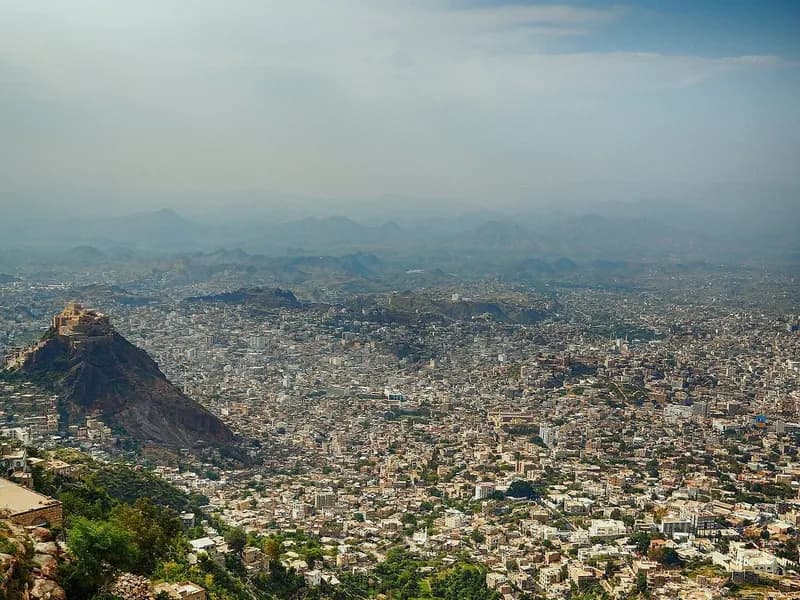 A wide view over the dense buildings of the city of Taiz in Yemen with the Saber mountain behind, photographed on 24 September 2014, a file photograph of the city and not of the recent fighting